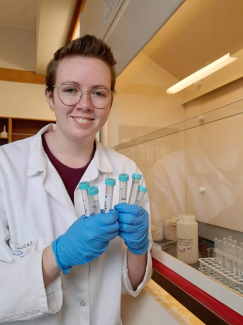 Masters student Madison Clarke in the lab doing density separation a technique where heavy liquid is used to make cryptotephra float out of other material.